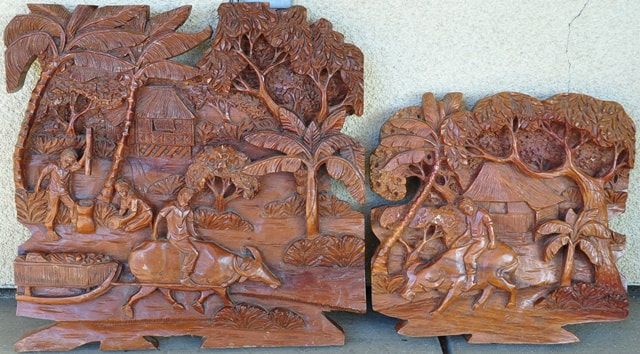 Pair of wood panels with relief carvings depicting Asian rural sceneries