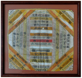 Framed late 19th century silk cigar ribbon band pillow top/cover