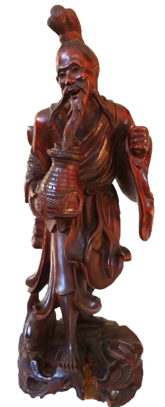 Antique rosewood sculpture of a Chinese Old man with a fish