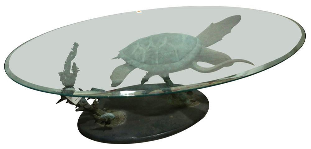 Oval glass top cocktail table with bronze base sculpture of a green sea turtle and fish, titled Honu Solo by Dale Evers