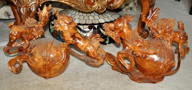 Pair of Burl wood carved Chinese sculptures of two Foo Dogs on a large ball