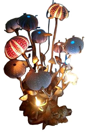 Lamp in the form of a plant with sea urchin shell shades and copper stems on driftwood base