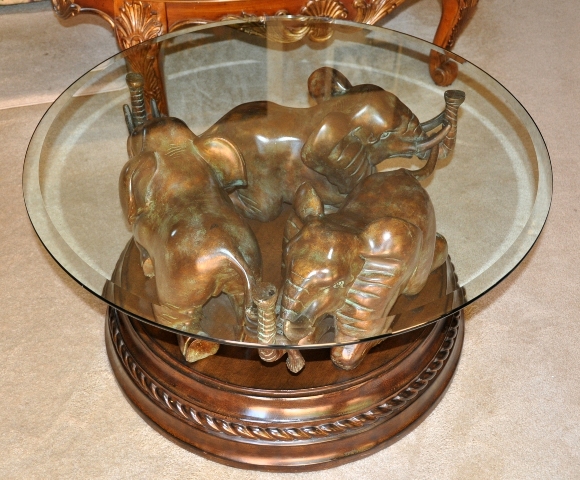 Coffee/tea table with 3 elephant sculpture base and glass top
