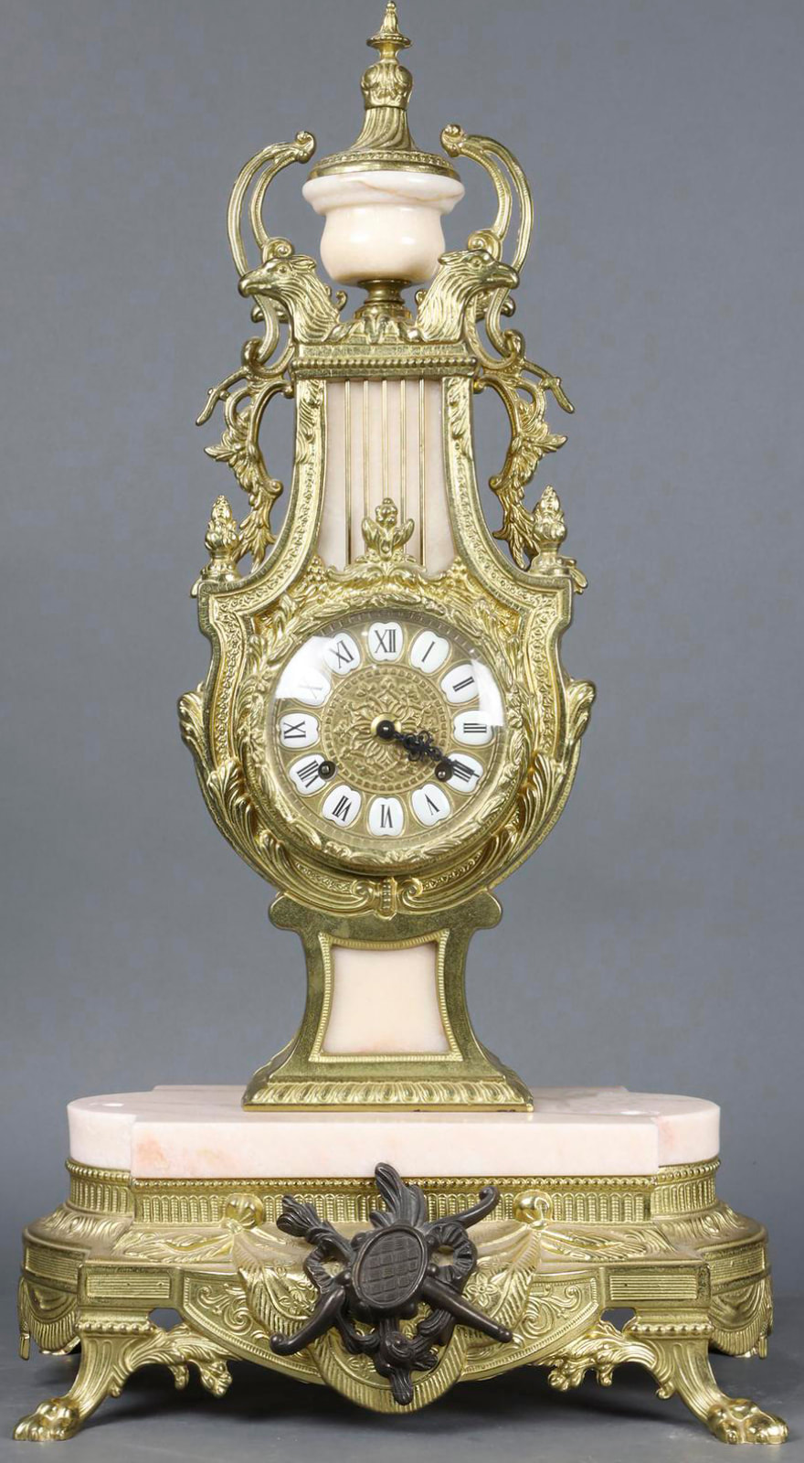 Italian Renaissance style gilt bronze and pink marble mantel clock