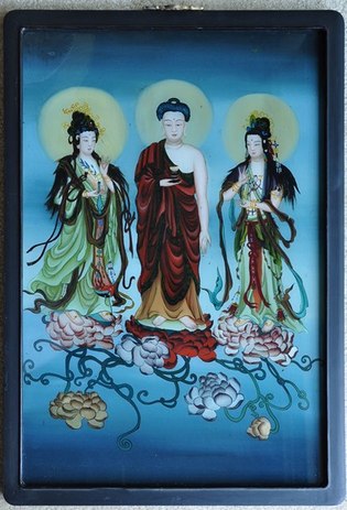 Reverse glass painting of Buddha and goddesses