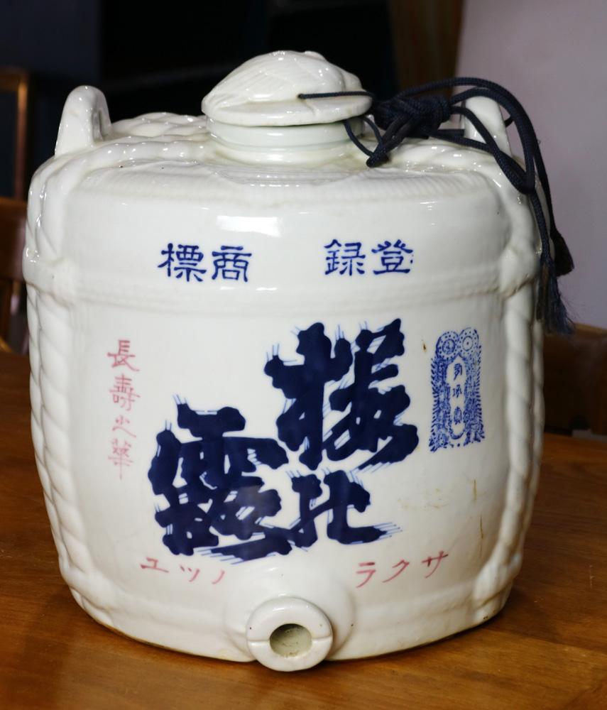 Antique Japanese blue and white barrel shaped ceramic sake dispenser