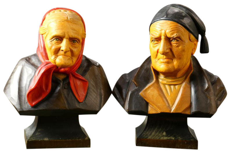 Pair of Hans Huggler-Wyss polychrome decorated carved wood busts of a man and a woman