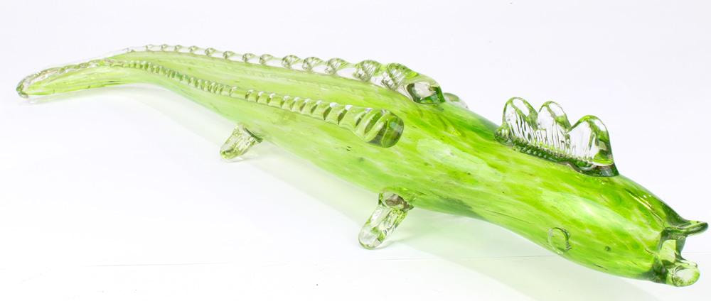 A green art glass lizard sculpture