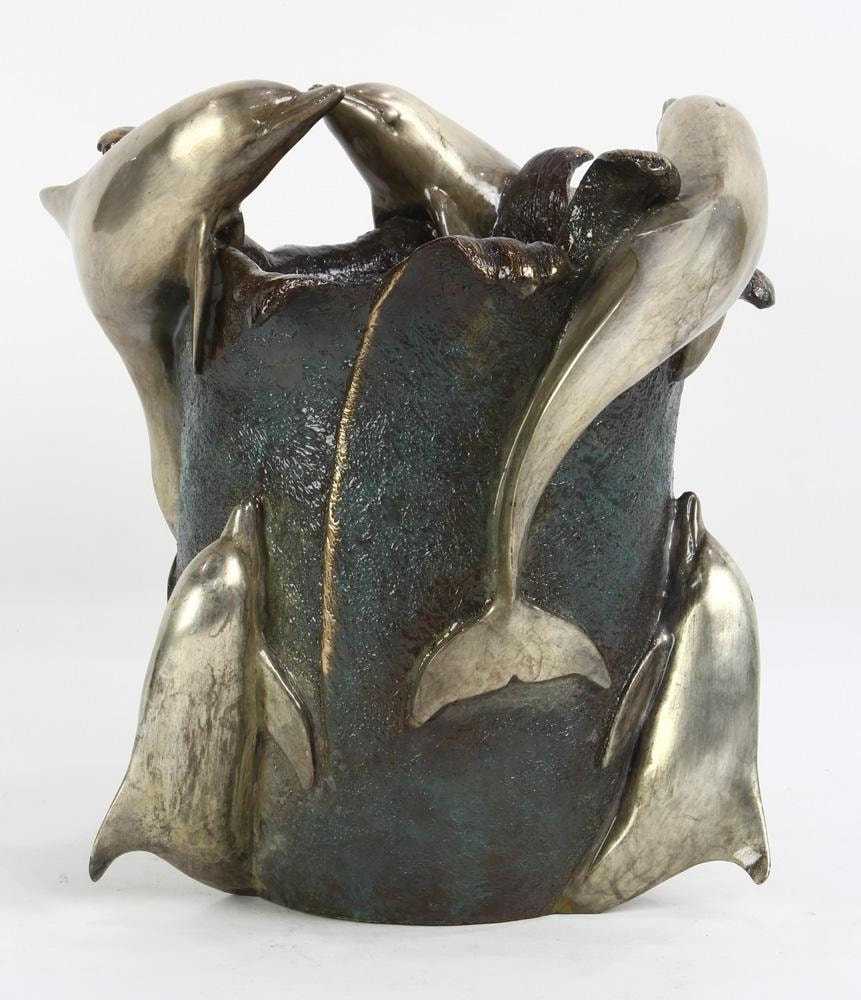 Patinated cast bronze figural wine cooler with 6 silver dolphins by Dale Evers