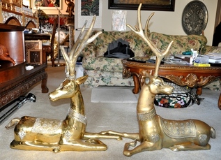 Pair of large brass statues of reclining deer