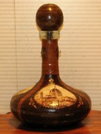 Italian leather trimmed glass bottle decanter covered with art