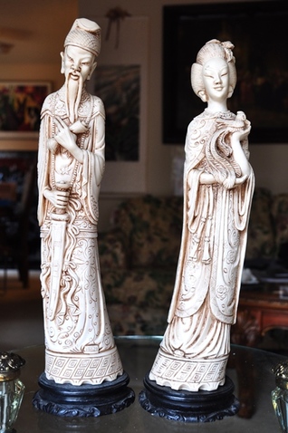 Faux ivory statues of Asian emperor and empress