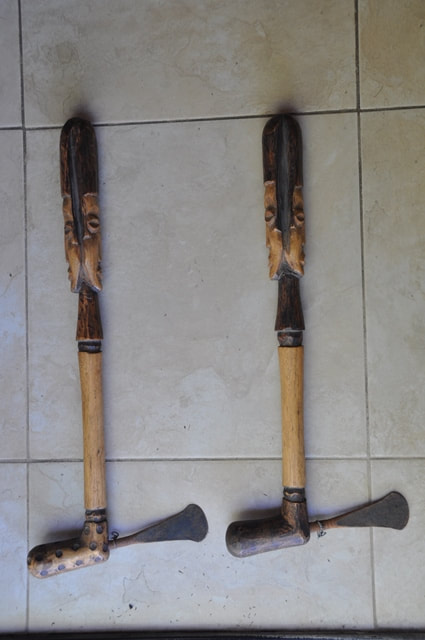 Pair of African axes with figural wood handles
