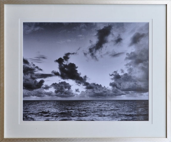 Framed B&W photograph of ocean and clouds by Silke Mildenberger