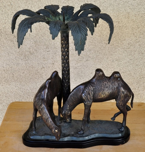 Bronze candle holder with 2 camels under a palm tree in the oasis