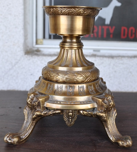 Ornate bronze votive candle holder