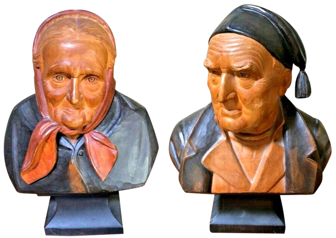 Pair of large Hans Huggler-Wyss polychrome decorated carved wood busts of a man and a woman