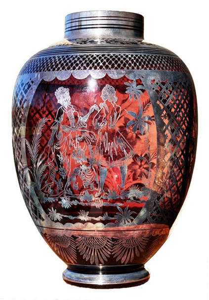 Cranberry glass vase with intricate silver overlay artwork