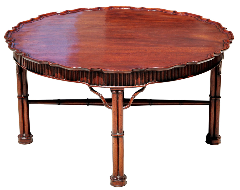 Unique Georgian style pie crust top mahogany coffee table with faux bamboo legs and stretchers