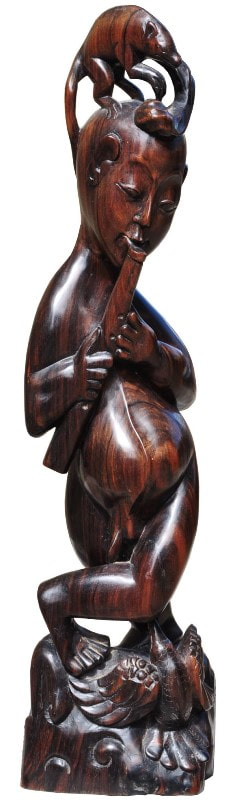 Southeast Asian carved hardwood sculpture of a flute player with a rat and a bird