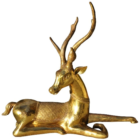 Large brass sculpture of a reclining deer