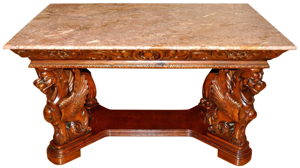 Renaissance style table with wood carved griffin supports and pink granite top