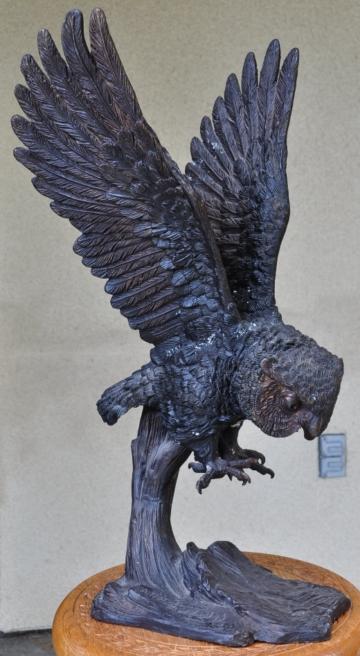Bronze sculpture of an owl on a tree branch by A. Tiot