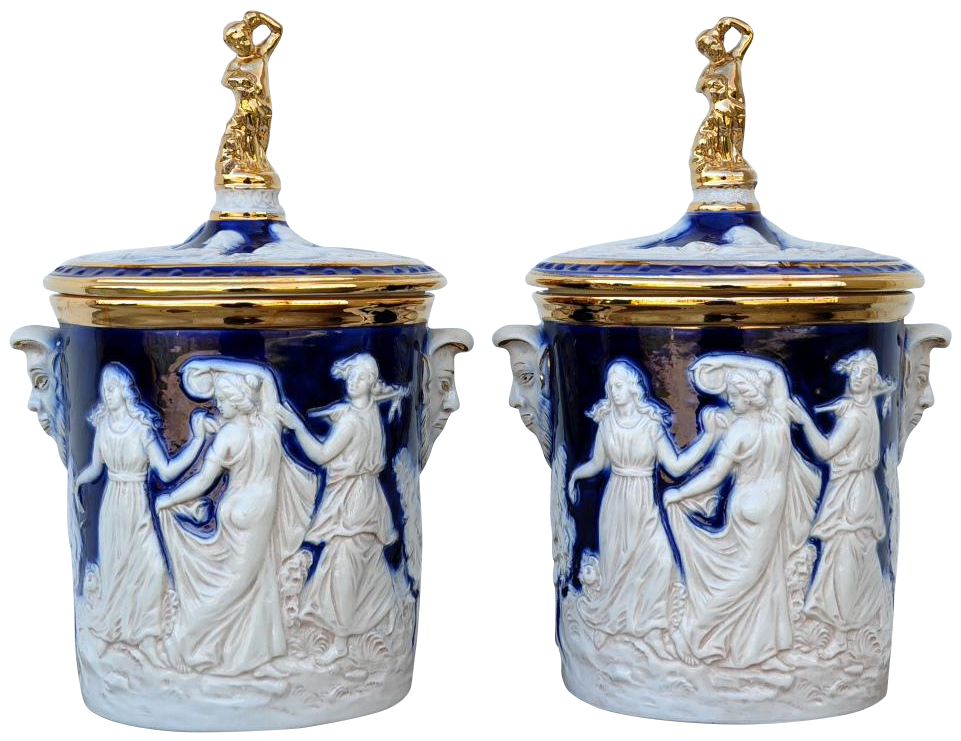 Pair of Italian ceramic wine cooler/ice bucket with relief artwork