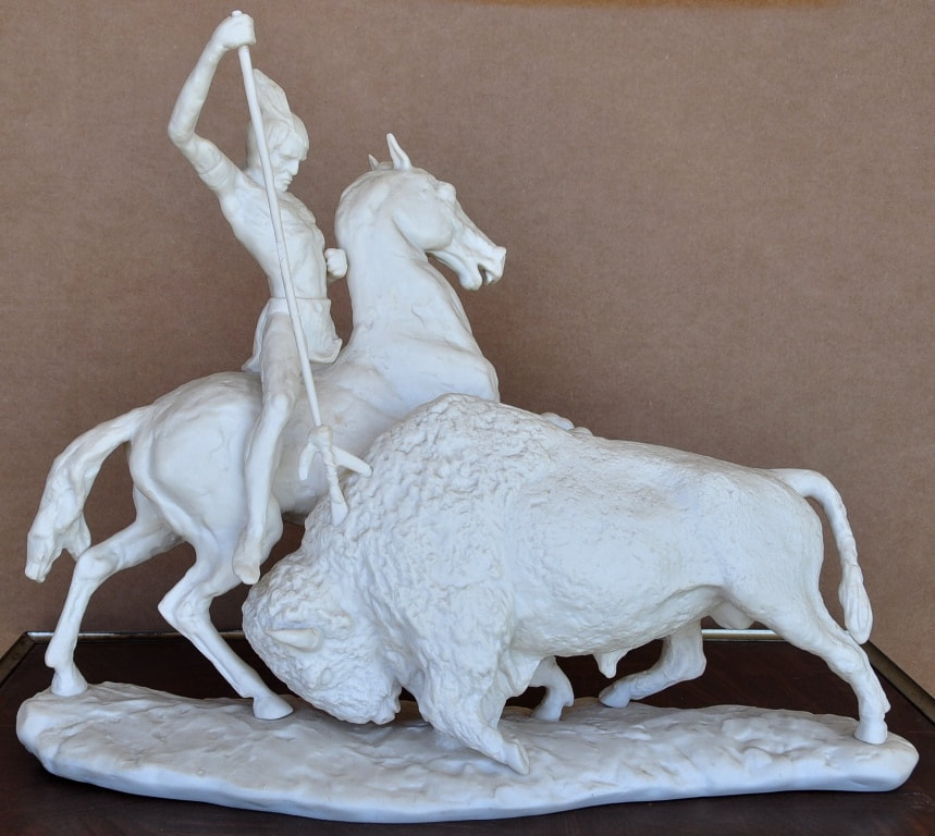 Laszlo Ispanky porcelain sculpture of a Native American on horseback hunting a buffalo