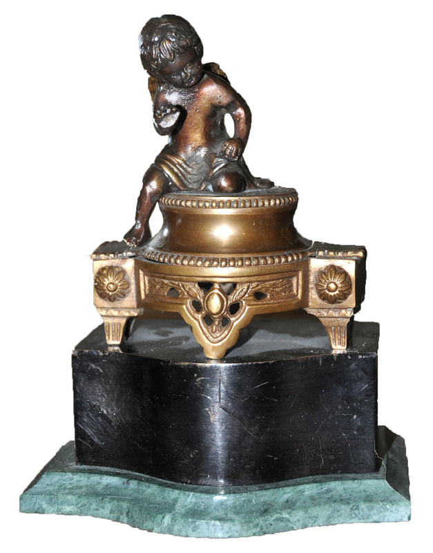 Bookend with bronze cherub sculpture