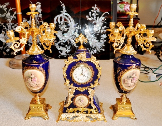 Epiag blue porcelain clock and candelabra garniture set