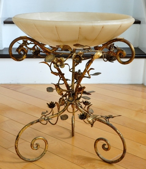 Custom made centerpiece with a large alabaster bowl on top of an Italian tole floral metal base