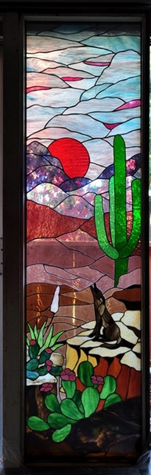Masterpiece stained glass window door of cayote howling in the desert landscape