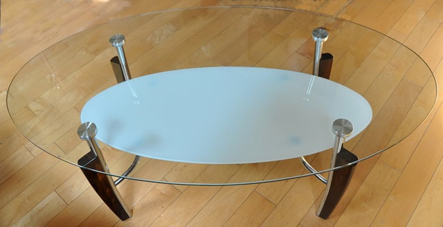2-tier oval glass top coffee table by Ashley Furniture