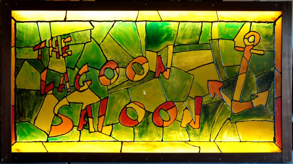 Vintage faux stained glass lighted sign of The Lagoon Saloon bar of San Mateo, California