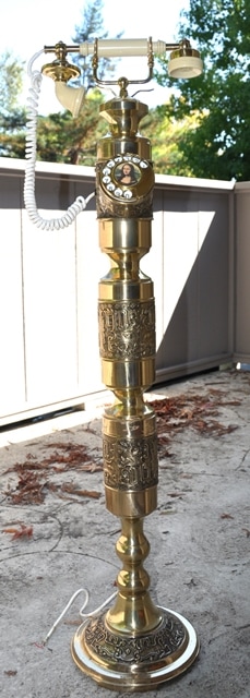 Tall French style brass telephone with intricate designs
