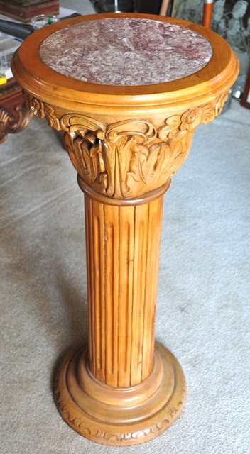 Wooden Corinthian pedestal with granite top