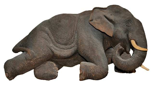 Teak wood elephant with realistic skin texture carved in Thailand