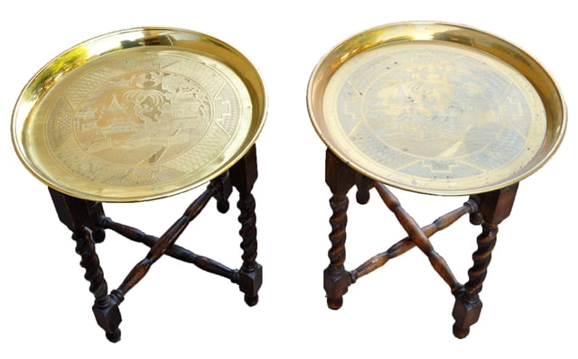 Pair of Asian end tables with engraved brass tray tops and wooden folding bases