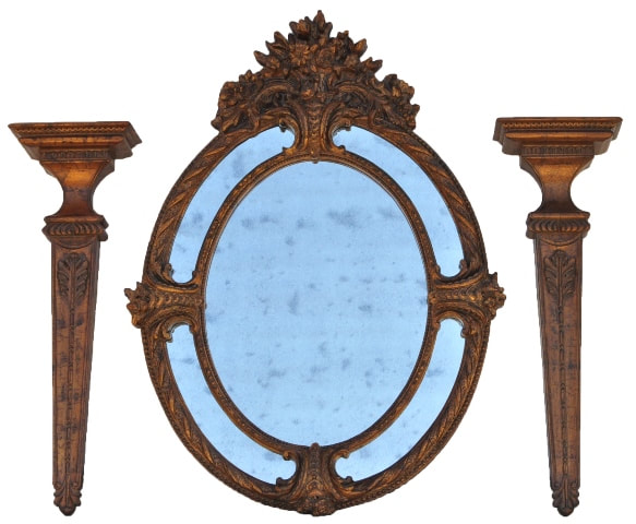 Large Napoleon III style antiqued oval mirror with ornate frame and a pair of corbel shelves