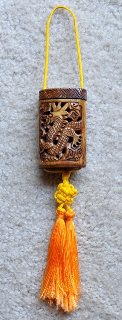 Japanese bone inrō with carved dragon and tassels