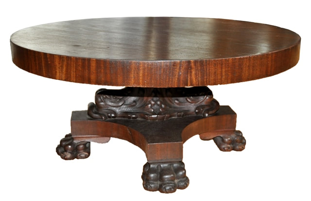 American Empire style pedestal coffee table with lion claw feet and carved dolphins