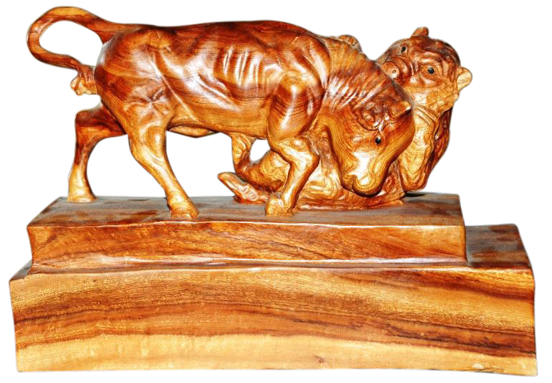 Wooden sculpture of a bull attacking a bear