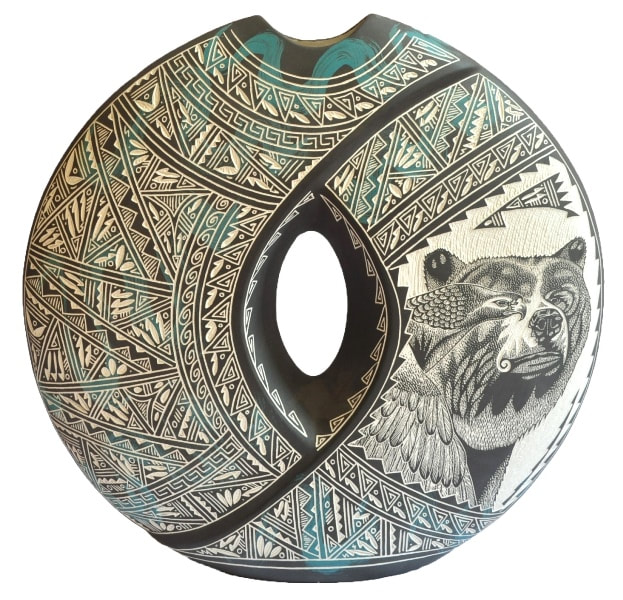 Large hand etched Acoma pillow vase by R. N. K. Sanchez depicting an eagle and a bear​