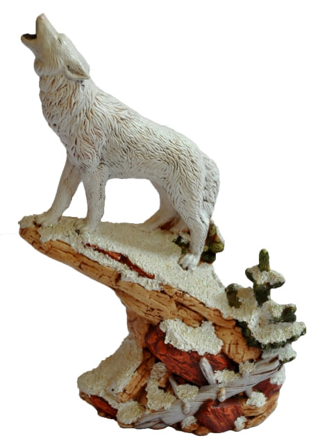 Ceramic sculpture of a wolf howling on a ledge in snowy winter