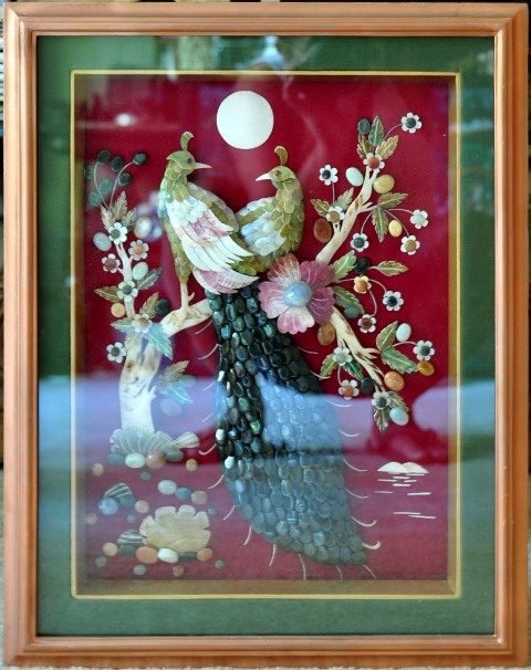 Burmese gemstone inlay artwork depicting two peacocks with green feathers