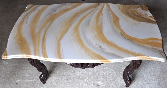 Vintage marble top coffee table with ornate wood frame