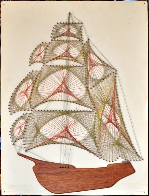 Metal wire string artwork on board of a sailing ship