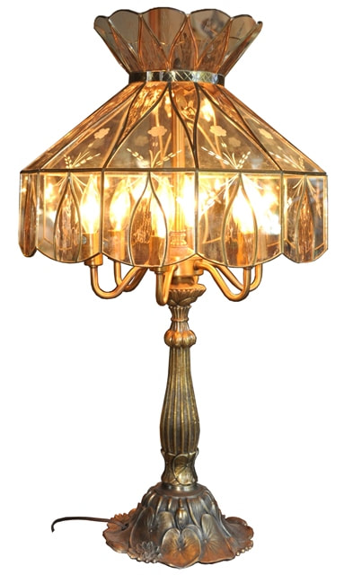 Table lamp with etched stained glass shade and ornate lily pad base