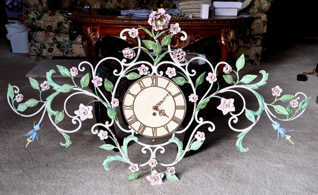 Antique wall clock with tole polychrome metal frame of vines, flowers and leaves